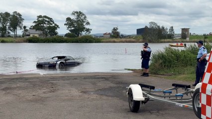 Watch as Police salvage a suspected stolen sports car from Raymond Terrace boat ramp - Newcastle Herald - January 13, 2024