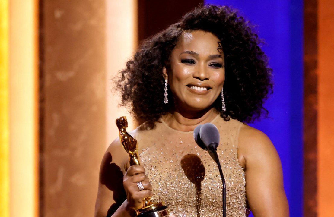 Angela Bassett thanked her fans for their "decades and decades" of support as she accepted an honorary Oscar.