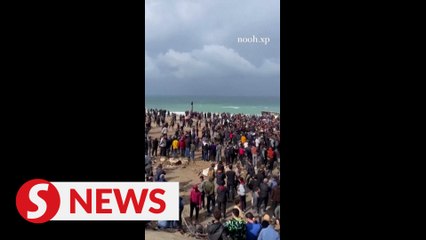 Palestinians scramble to receive aid in Gaza City
