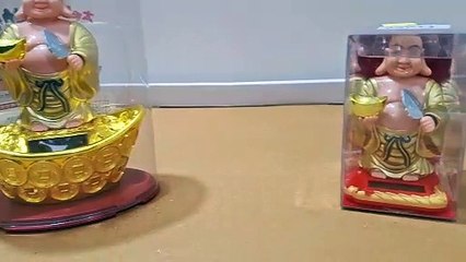 Unboxing and Review of Solar Plastic Laughing Buddha with Waving Fan and Ignot, Moving Head with Health, Wealth, Prosperity for Office, Home, Dash Decor