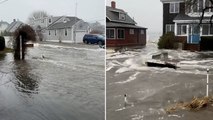 Floodwater carries debris down street amid Maine storm