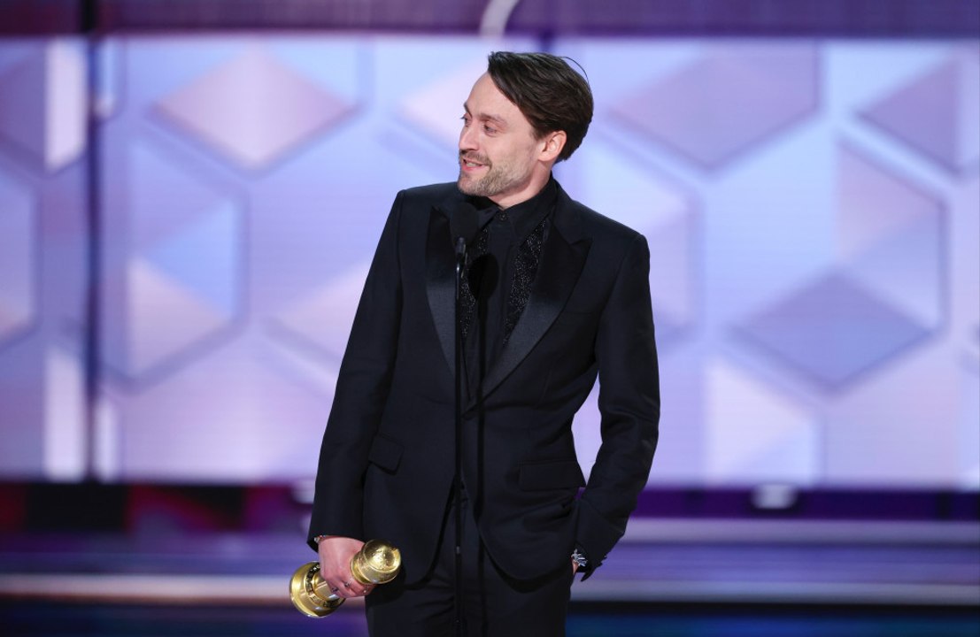Kieran Culkin's Golden Globe currently sits between his kids' Sesame Street stuffed animals