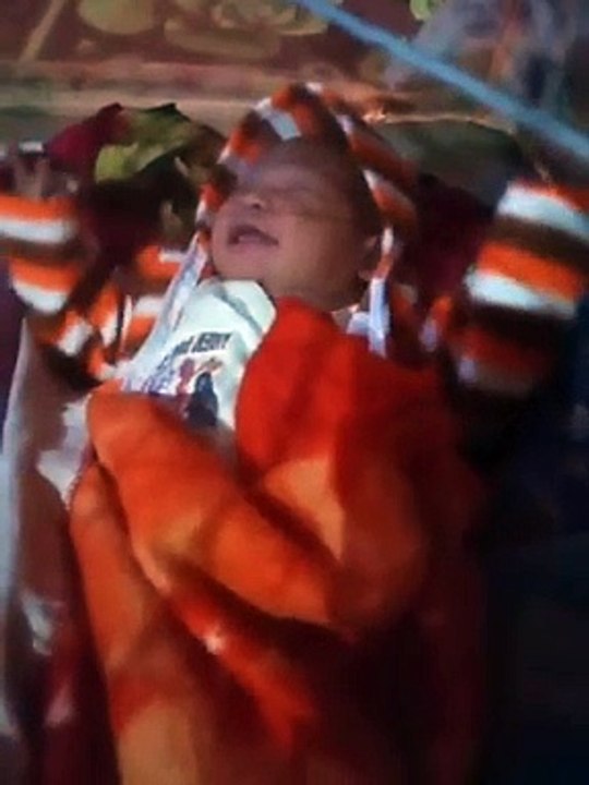 I am less than a month old. I am relaxing under the mosquito net. Rayhan Nadir Rana