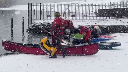 Paddleboarders appear unfazed by icy conditions in Lake District