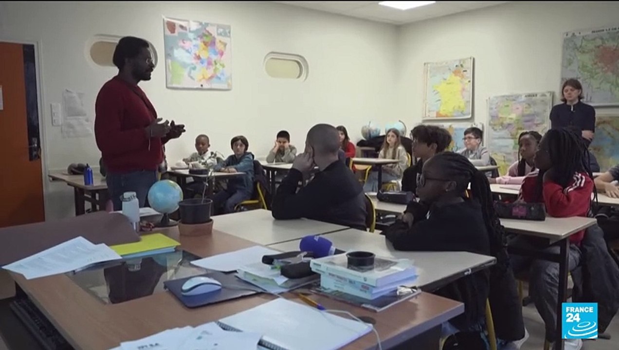 France's Macron seeks public school reform with school uniforms, national anthem