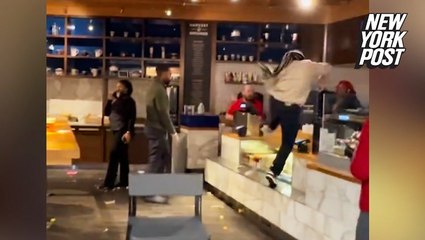 Airport restaurant employee leaps over counter and fights managers