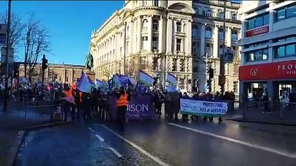 Strikers make their way to City Hall, Belfast for a rally