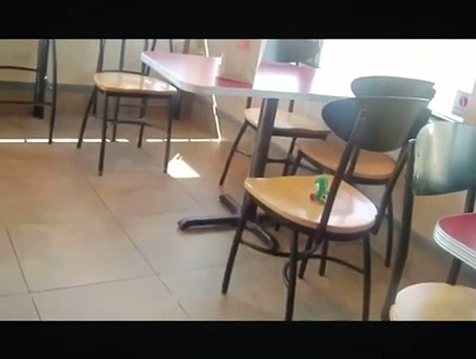 Guy Sits Down on Her Chair on Yoshi’s Toy Plush