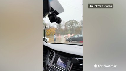 Why is he doing that? Van crosses dangerous floodwaters