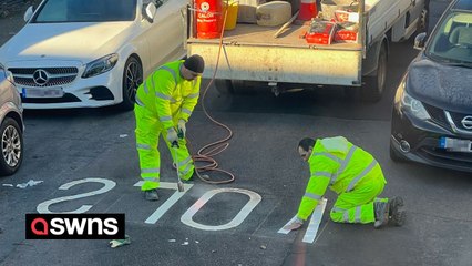 Locals confused as road painters spell word 'SLOW' backwards on the tarmac
