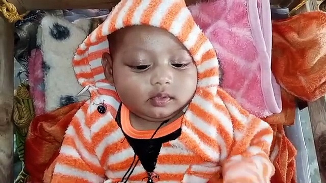 I am swinging comfortably on the swing. Dad is making a video.Rayhan Nadir Rana