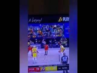 Lil Wayne smoking in the virtual crowd at Lakers game