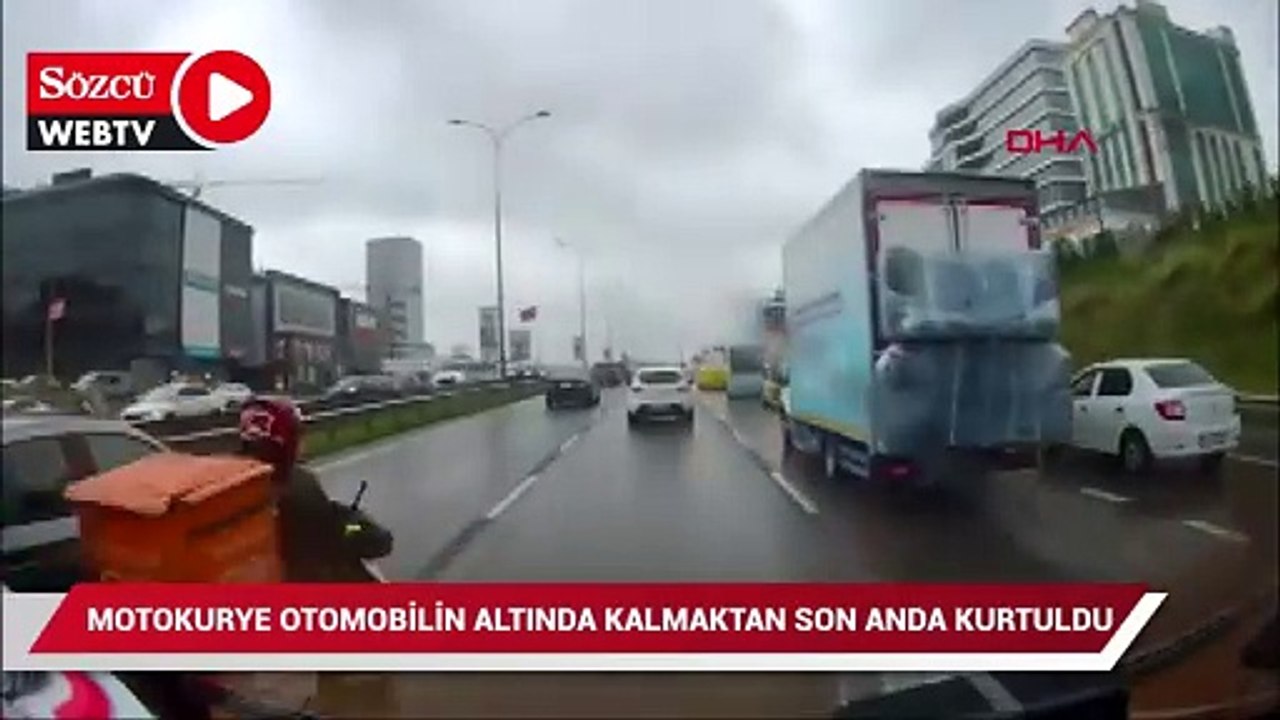 Motokurye otomobilin altında kalmaktan son anda kurtuldu