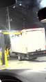Truck Driver Drives Box Truck Into Drive Thru Arch
