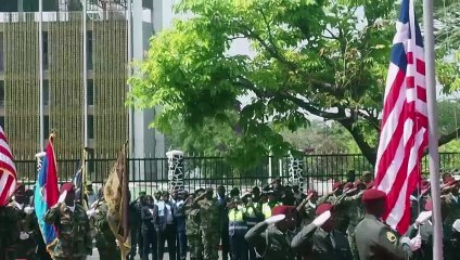 Moment Liberia President Boakai freezes at podium