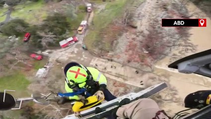 ABD'de 15 saat boyunca derede mahsur kalan sürücü helikopterle kurtarıldı