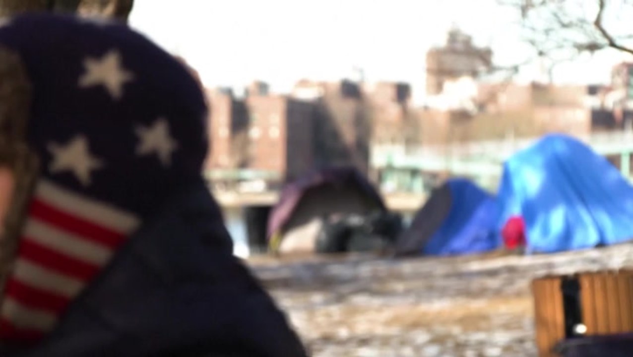 Migrants face bleak winter conditions in camp outside New York shelter