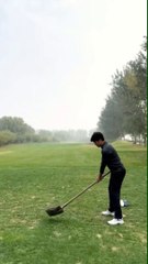 A Man Enjoying Playing Golf With Shovel