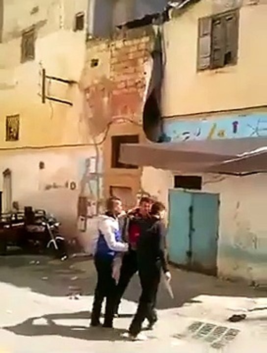 three moroccan fighting with a knife in the street