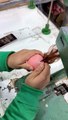 Doll Maker Sews On Hair