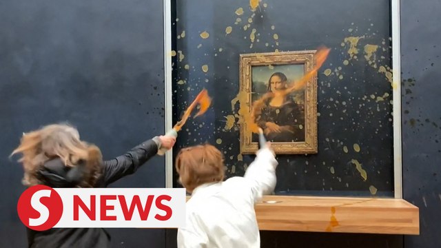 Climate change activists throw soup at Mona Lisa painting in Paris