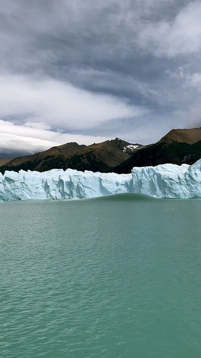 Sightseers Watch Iceberg Emerge From the Perito Moreno Glacier