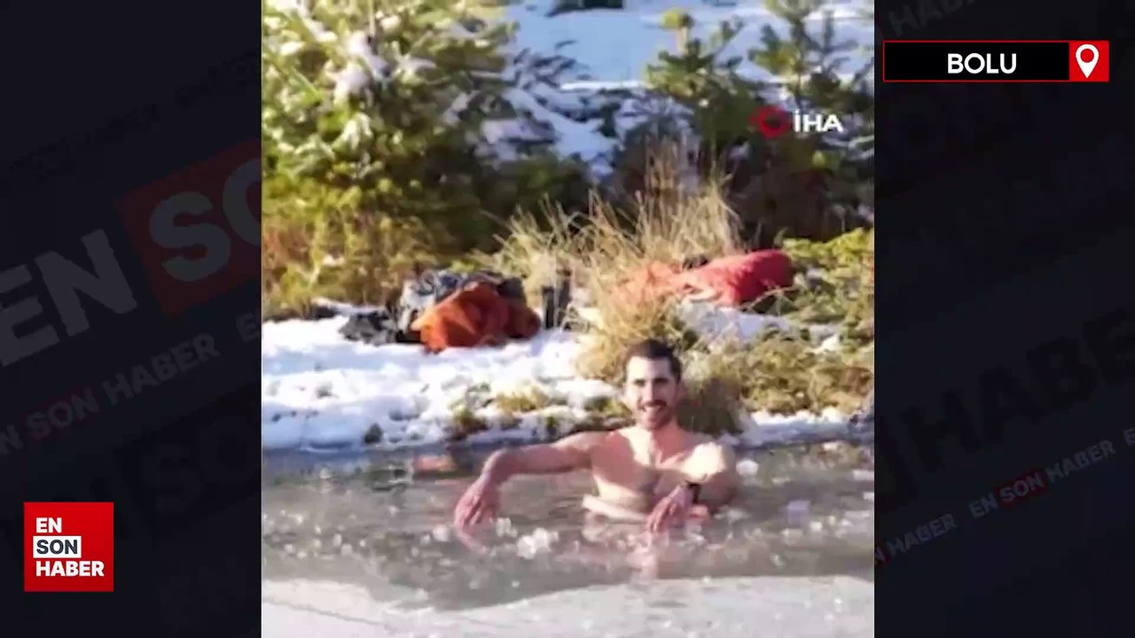 Bolu'da soğuk havaya aldırış etmeden donmuş göle girdi