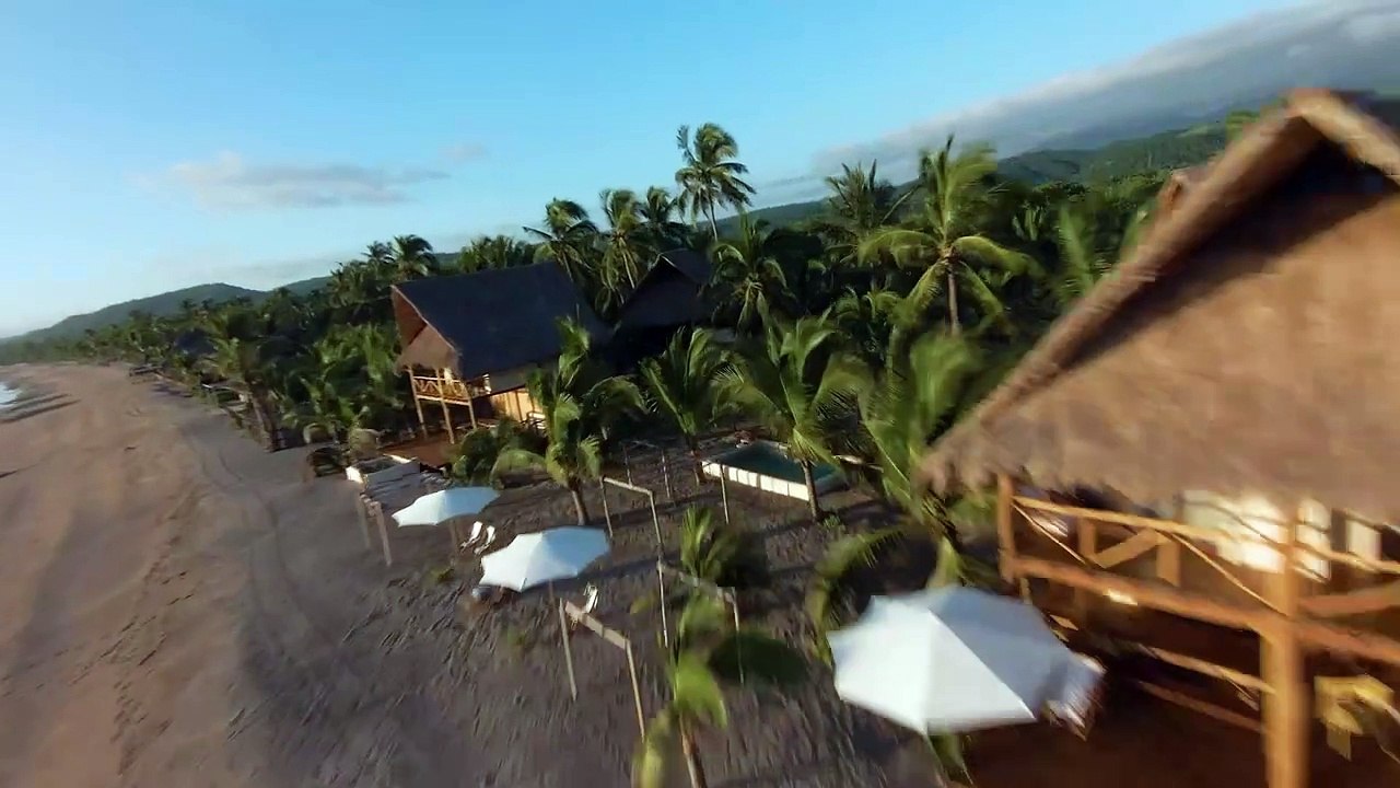 Dynamic drone video of a sunny beach