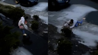 Funny moment woman slowly slips on sidewalk