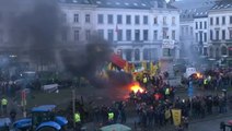 Protesting farmers light fires and throw flares outside European Parliament building