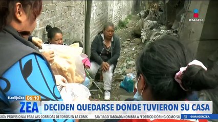 Víctimas de incendio en el Edoméx no se apartan de lo que un día fue su hogar
