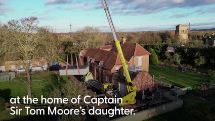 Crane lifts spa from Captain Tom’s daughter’s Bedfordshire home