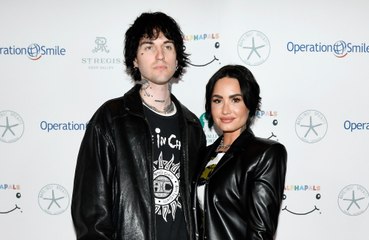 Demi Lovato feels "happier than ever" after "overcoming a lot of hardships"