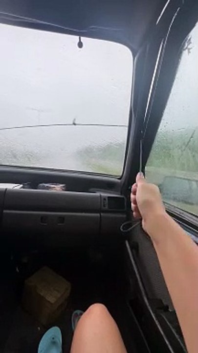 Couple Clever Solution to Broken Windshield Wipers
