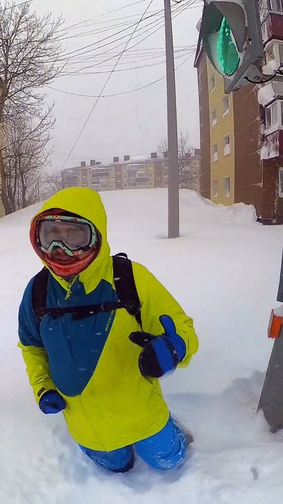 Man Crosses the Street During an Intense Blizzard