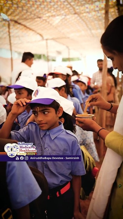 Naam being applied to schoolchildren on arrival at the camp _ Kolhapur Medical & Healthcare Camp 24