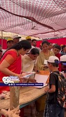Parampujya Nandaai distributing notebooks to schoolchildren _ Kolhapur Medical & Healthcare Camp 24
