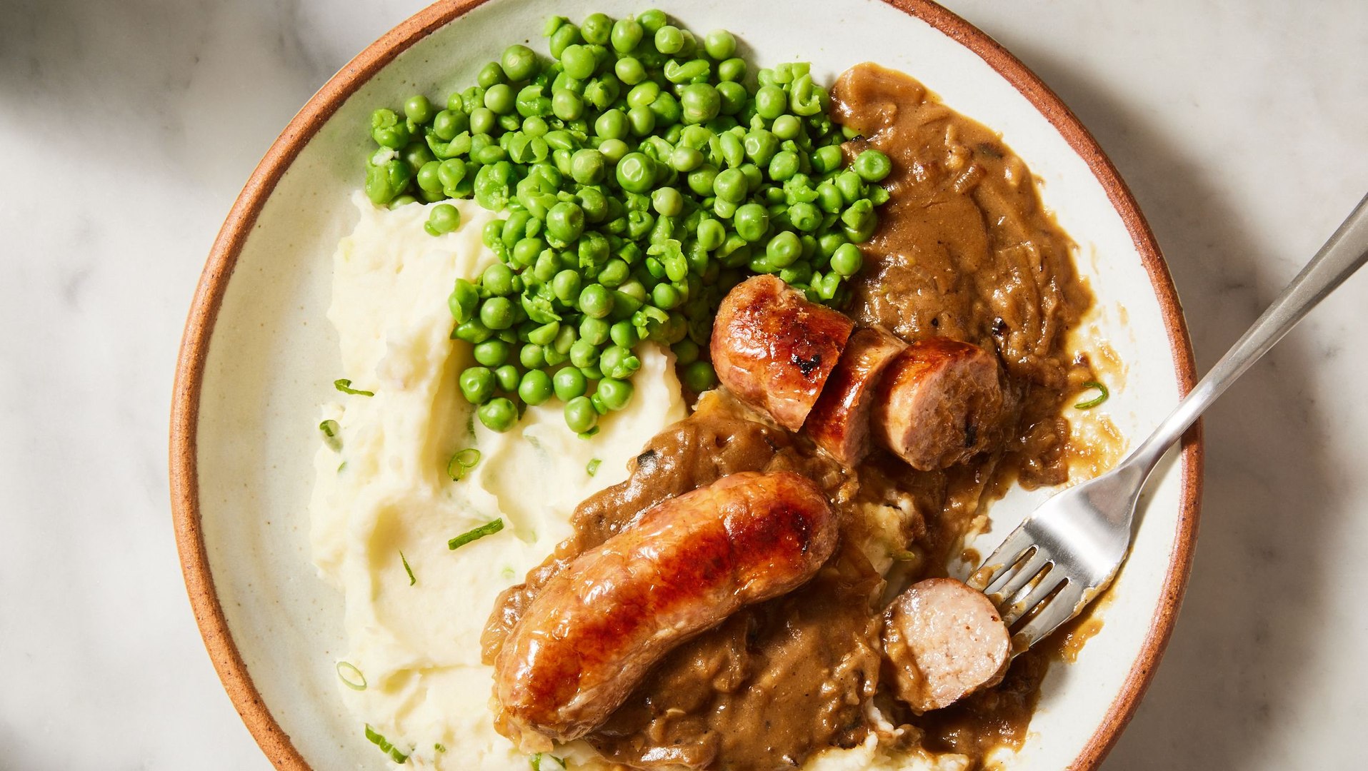 ⁣Celebrate St. Patrick's Day With Traditional Irish Sausages & Champ