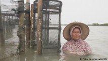 Residents of Indonesian village adapt to life on sinking land