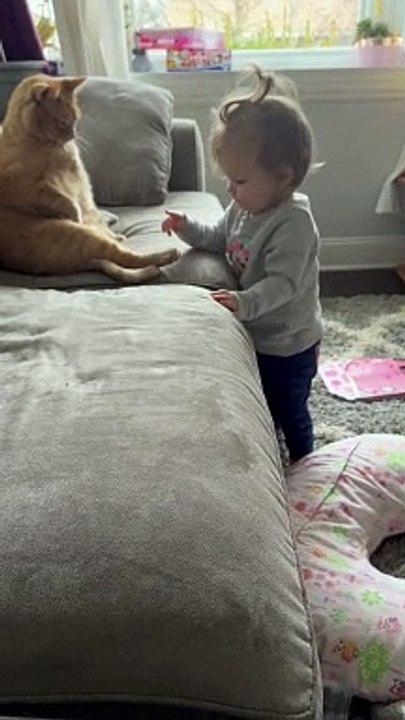 Girl Nibbles Cat's Toe Beans