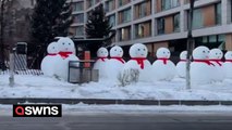 Bizarre video shows over 100 giant snowmen taking over a Chinese neighbourhood