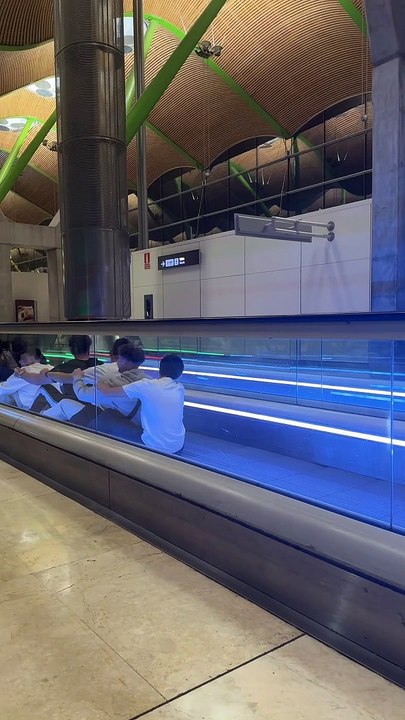 Boys Row Down Moving Sidewalk