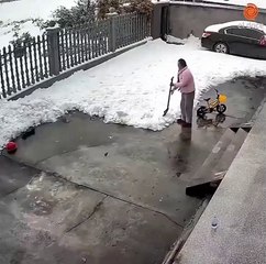 Women knocked while cleaning snow in yard