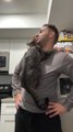 Cat Refuses to Get Down From Owner's Shoulders and Tightly Hugs Him