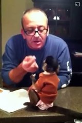 Baby Gaitlyn 6m old December 3 2012 with her paw paw having fish her brother cooked! Gaitlyn is not much of a seafood eater