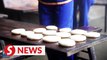 Ethnic Yao people make glutinous rice cakes for Lunar New Year