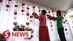 Bali voters cast ballots in Valentine's Day-themed polling station