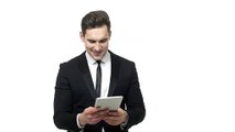 Shocked businessman reading bad news on a tablet - Free HD Video Clips & Stock Video Footage at Videezy!