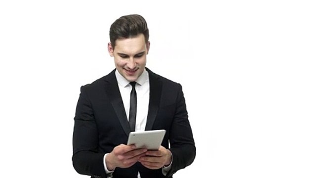 Shocked businessman reading bad news on a tablet - Free HD Video Clips & Stock Video Footage at Videezy!