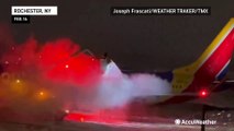 De-icing plane during harsh winter conditions at New York airport